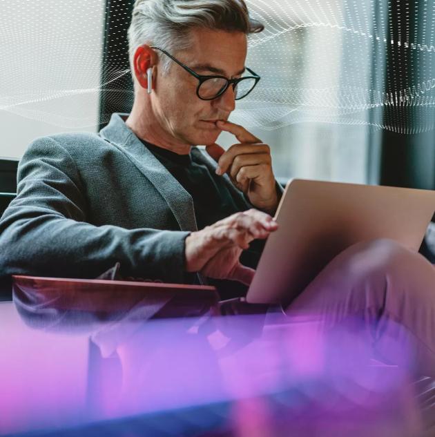 SecTech_2022_ManOnLaptop_AdobeStock_336028070_DOTS_PURPLE_EDIT