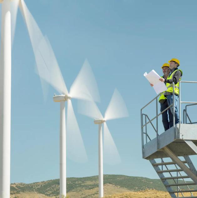 SecTech_2025_Energy_Workers Surveying Wind Turbines_AdobeStock_357290425