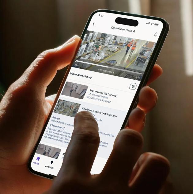 Person holding mobile phone with the Securitas Technology cloud video surveillance app, giving clients access to live video and security alerts from anywhere