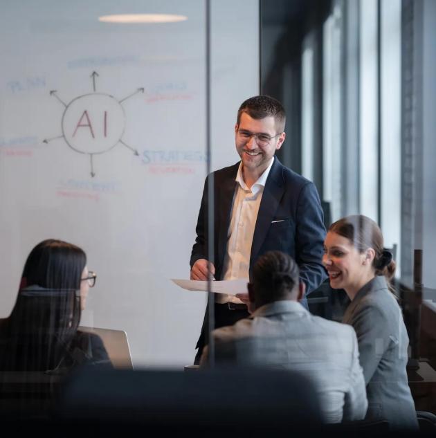 Diverse business team in a modern office during a meeting, discussing artificial intelligence strategy. Concept of AI innovation, teamwork, leadership, corporate planning, professional collaboration.