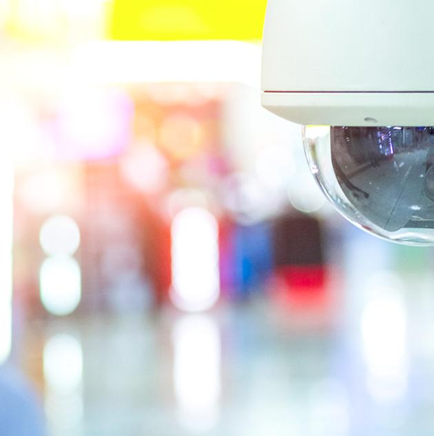 Security camera on ceiling of hallway