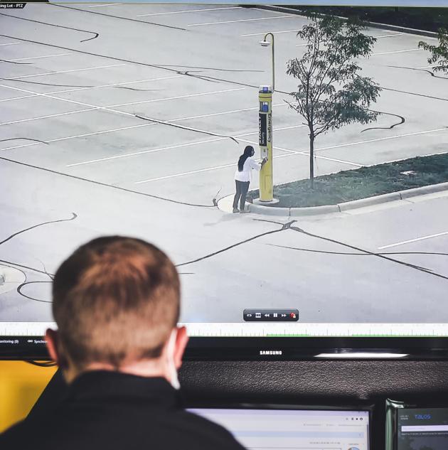 Man watches video surveillance feed