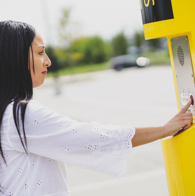 woman pushing help button