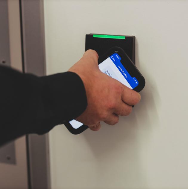 access control pad with iphone and hand
