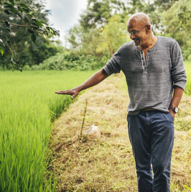 man in field social responsibility