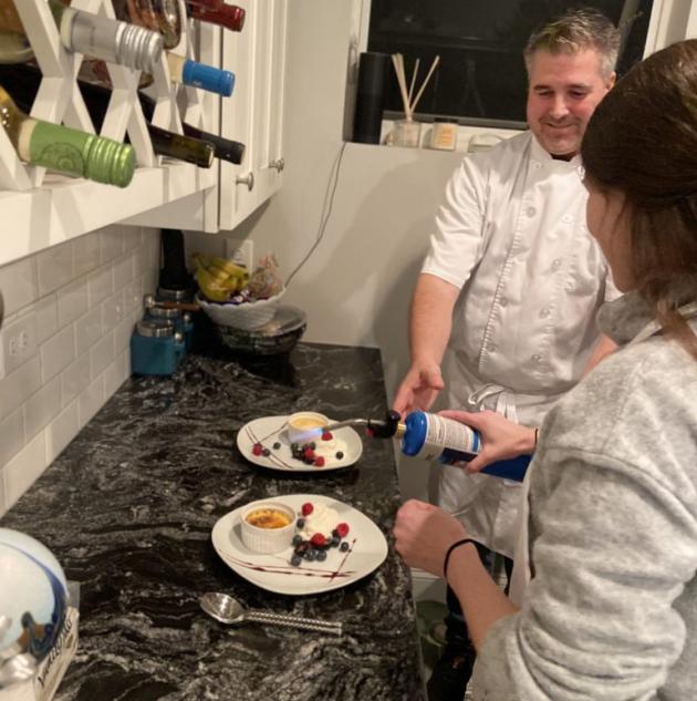 Chefs prepare two dishes to be served