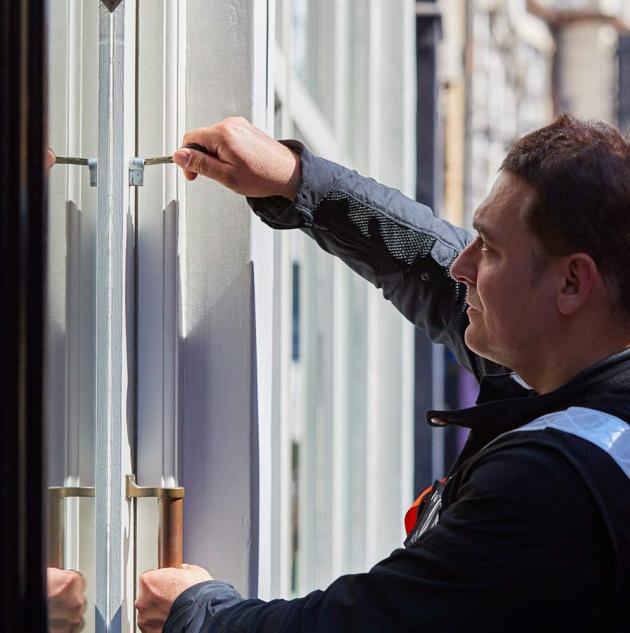 Professional keyholder unlocks door