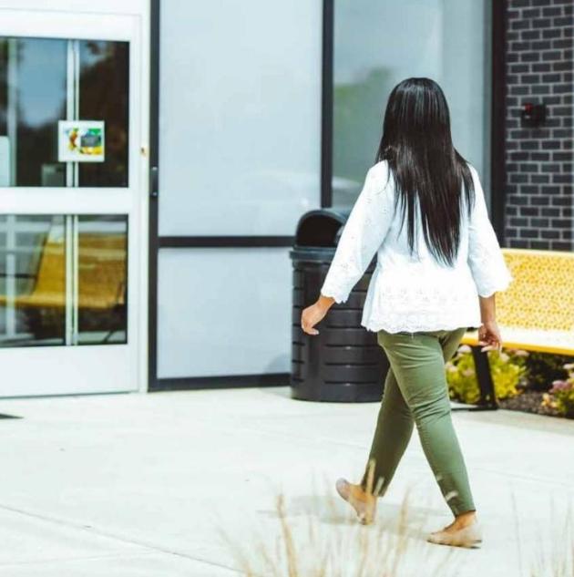 Woman entering through door access control system 