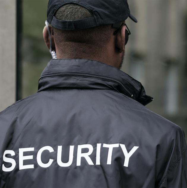 Patrol guard with jacket that says "Security" across the back.