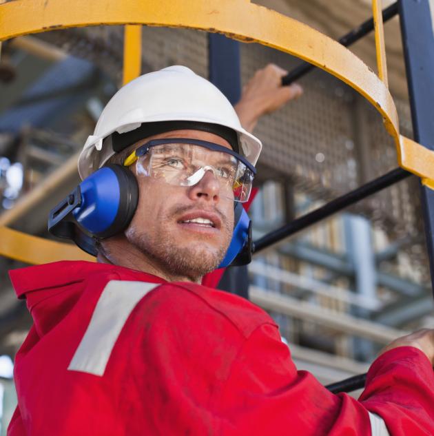 Construction worker climbing stairs