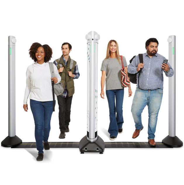 4 people walking through security weapons detection system
