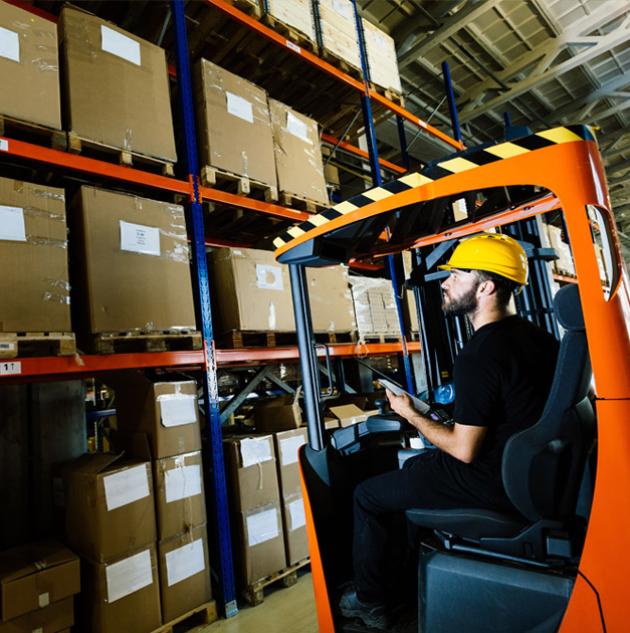 A forklift operator working in a warehouse