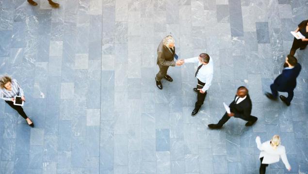 aerial view of office workers shaking hands