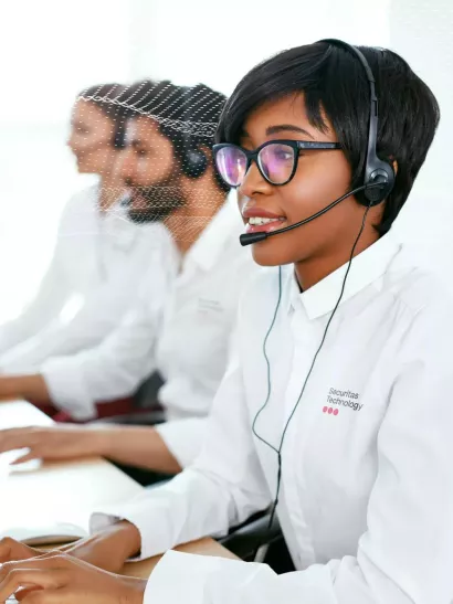 Security monitoring employee providing support for security system 24/7 monitoring services