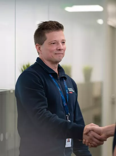 security professional shakes hands with customer