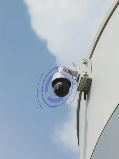 AI-powered outdoor dome security camera mounted on a building exterior, monitoring a commercial property with intelligent video analytics for real-time threat detection and surveillance efficiency
