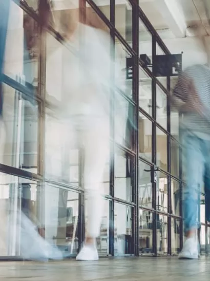 Employees walking in an office building