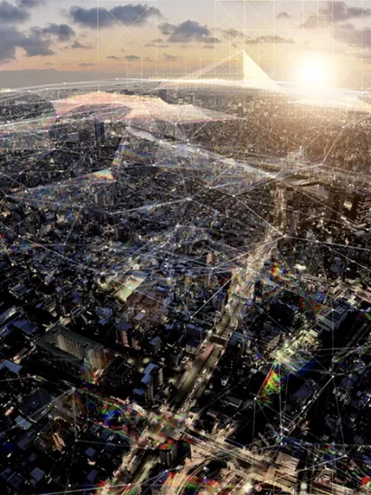 Aerial view of nighttime city with graphic overlay.