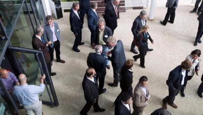 Office workers walking through office building using business access control system