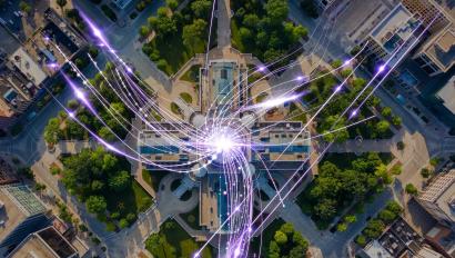 A digital technology overlay on a cityscape, highlighting key global security trends with data points, cybersecurity measures, and smart city solutions.