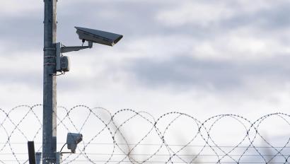 Surveillance Camera and barbed wire, border, prison, concept picture