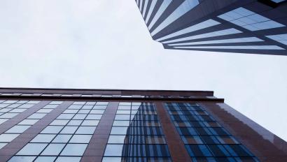 Two tall buildings against sky