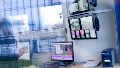 View of security monitor setup through glass