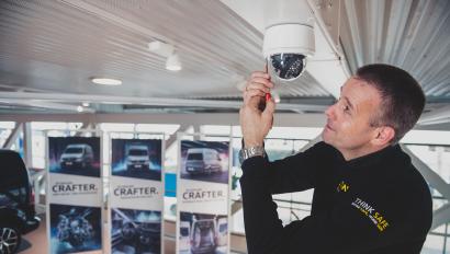 Man installs security camera in car dealership