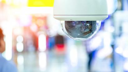 Security camera on ceiling of hallway