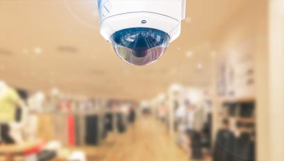 Security camera on ceiling of clothing store