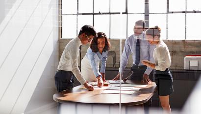 Business meeting seen through glass wall