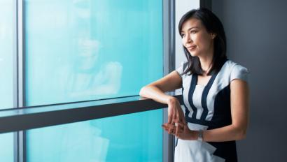 Woman looks out window