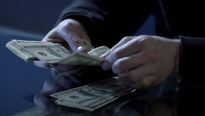 Close up of hands counting money