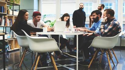 Employees work at a round table