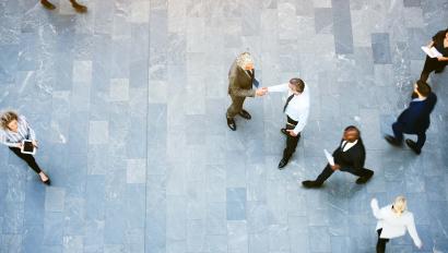 Aerial view of office workers shaking hands