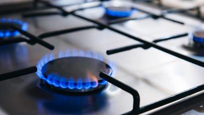 Lit burners on gas stove.