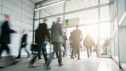 Business People Walking in a modern entrance