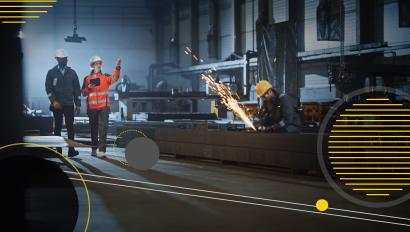 Warehouse staff walking through industrial manufacturing facility